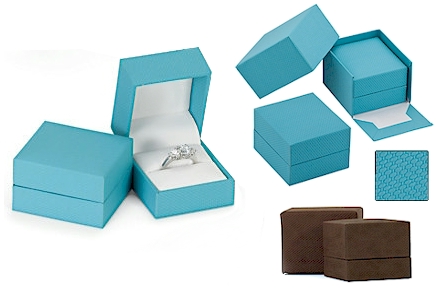 Aqua or chocolate colored patterned leatherette boxes.